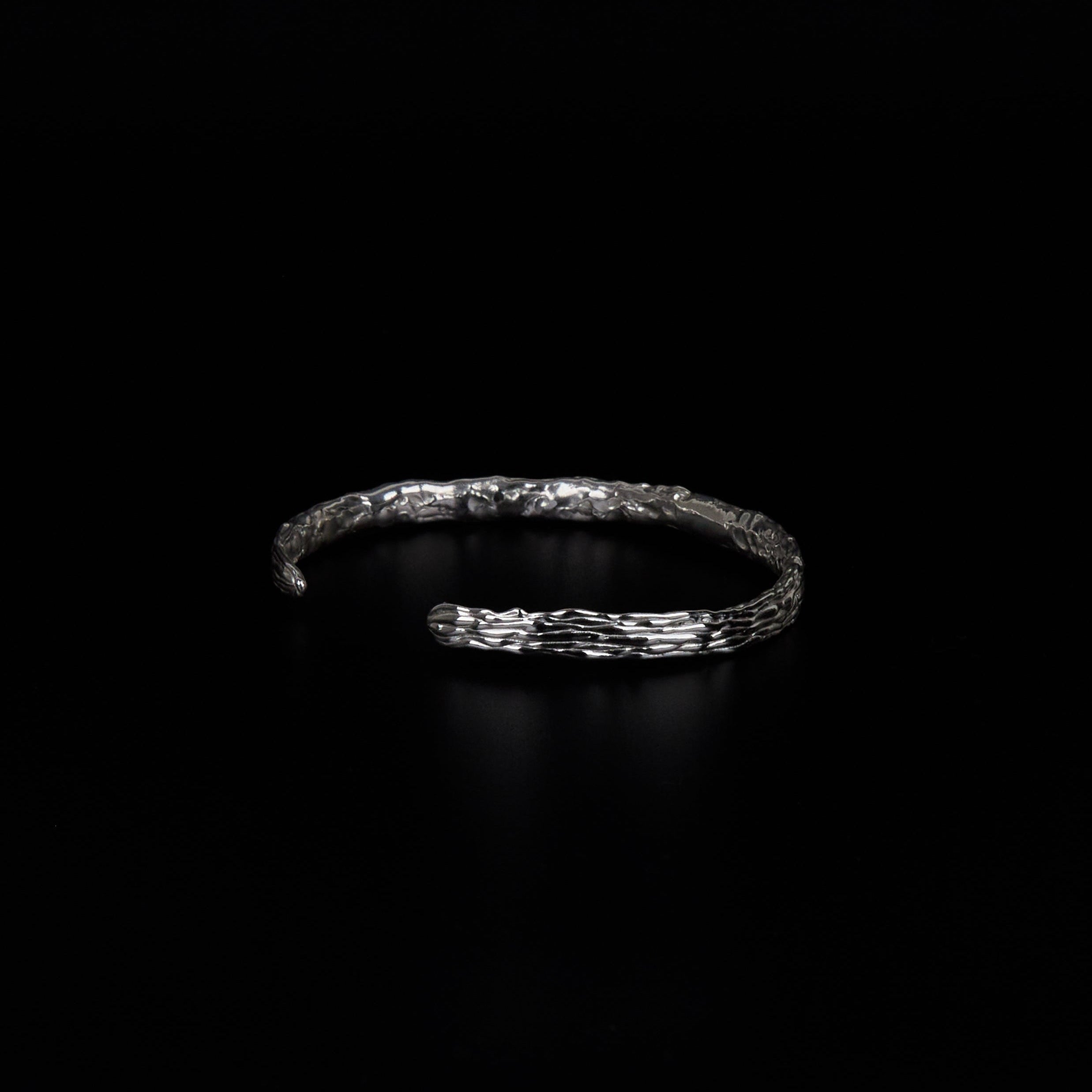 Transmission cuff high shine textured detail