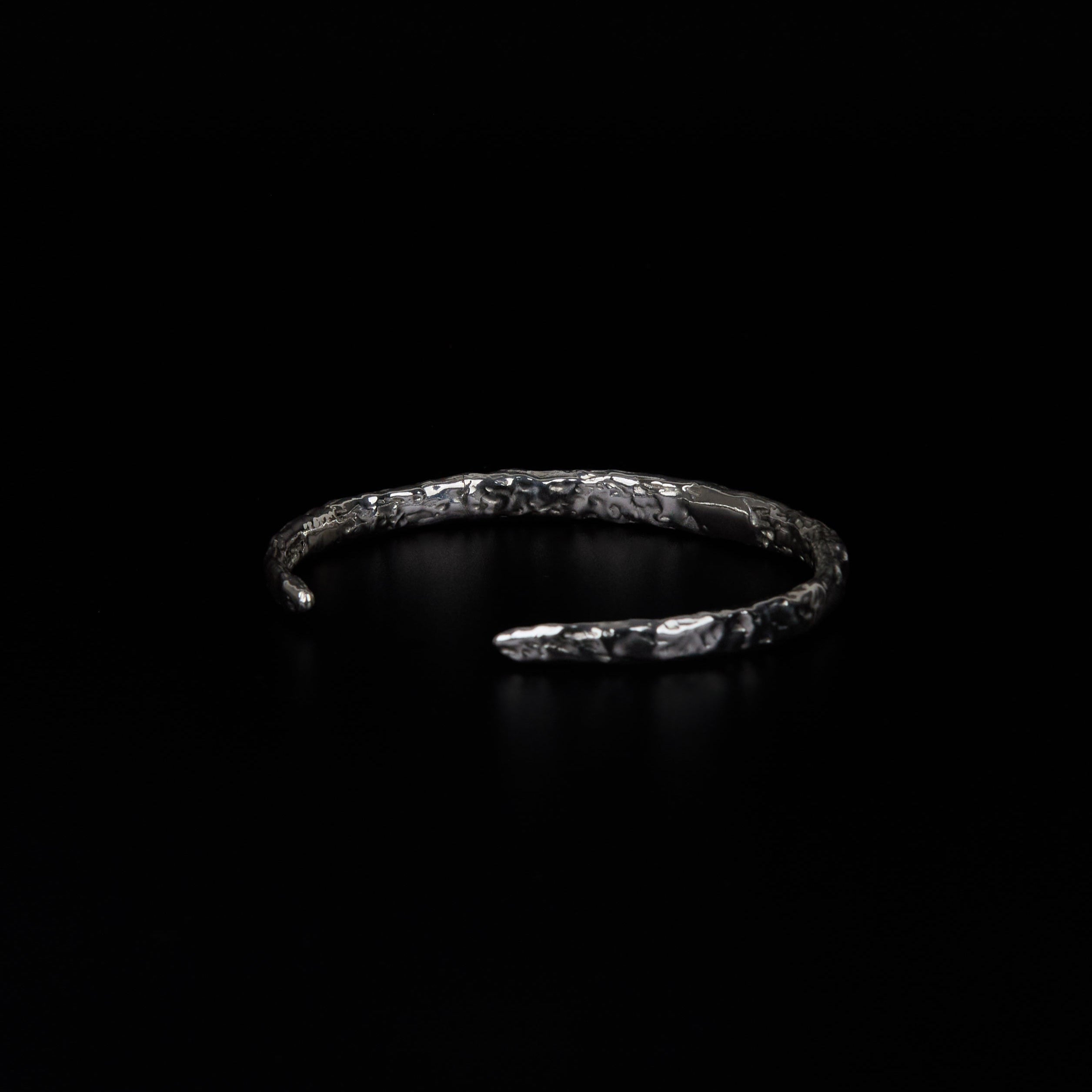Molten textured silver cuff with layered surface detail
